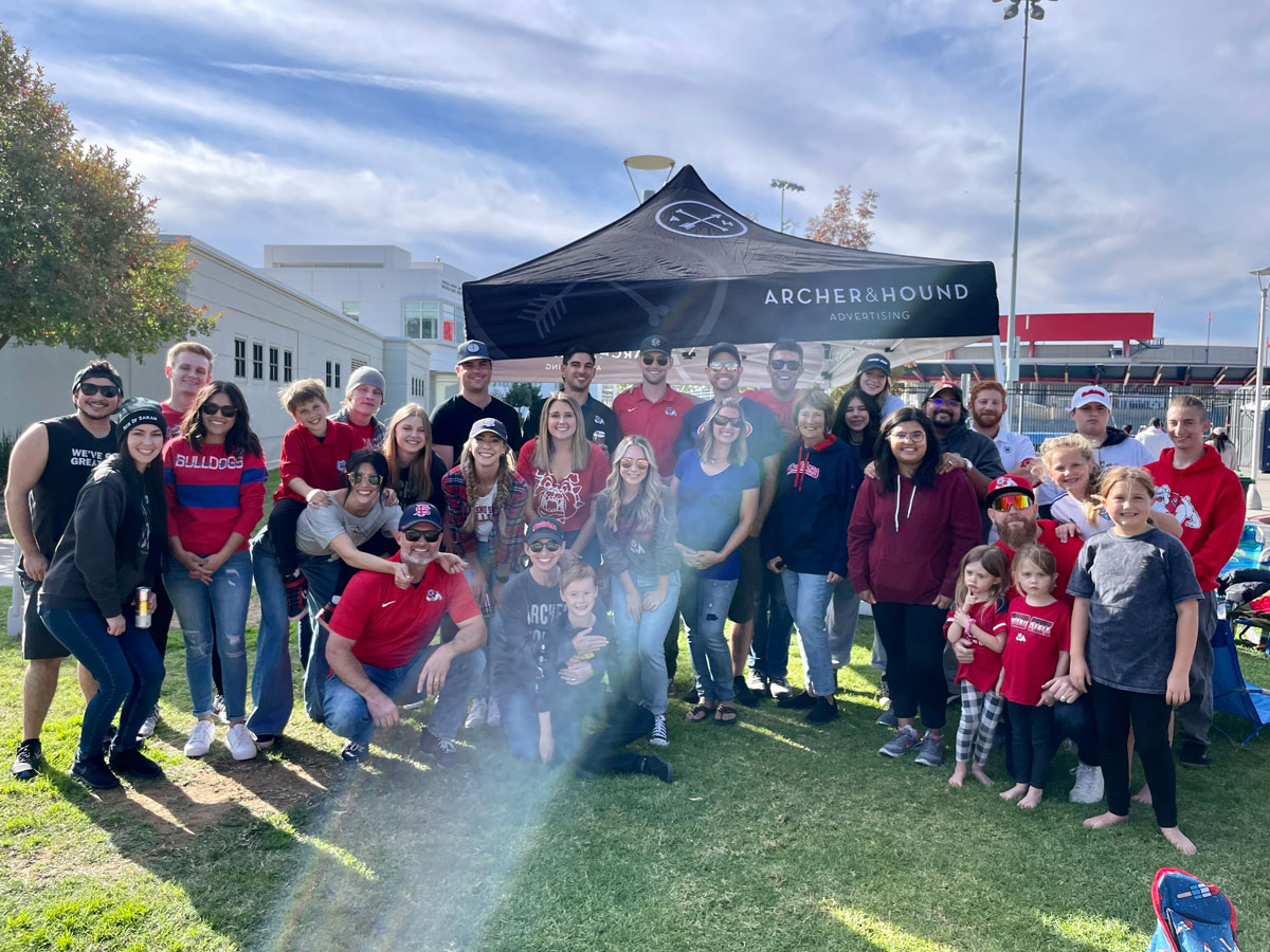 Staff of Archer & Hound with their family members during a company outing tailgate of the 2021 Fresno State Bulldogs Homecoming Football Game